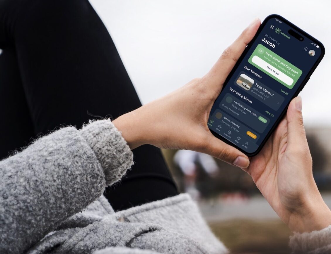 The Curbswap app showing an upcoming street cleaning reminder on a phone